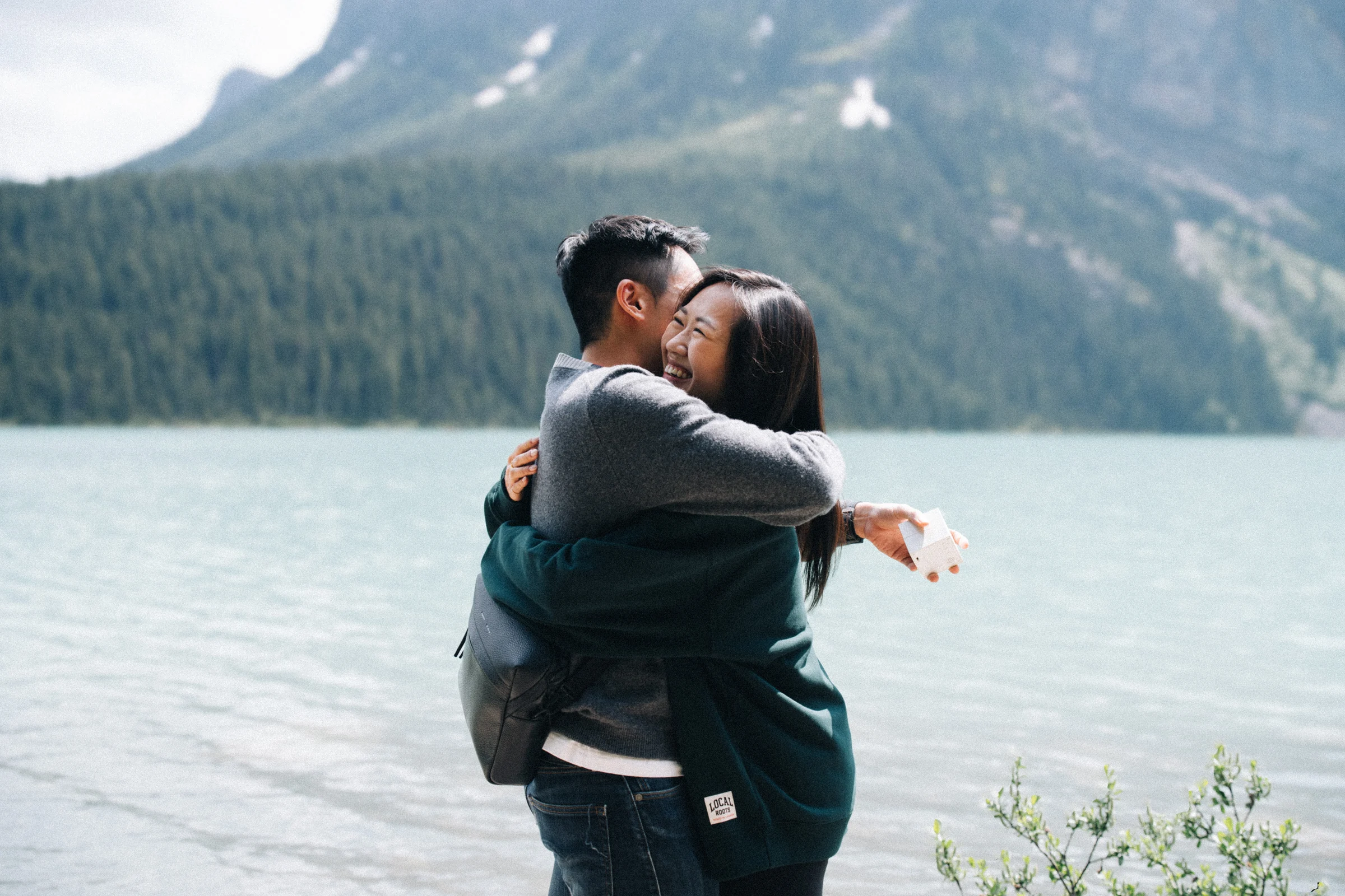 Rachael embraces Desmond beside Lake Louise in Banff National Park.