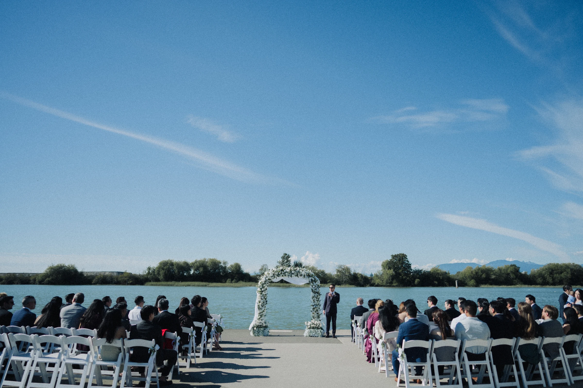 Wide view down the aisle towards the flower arch and Fraser River.