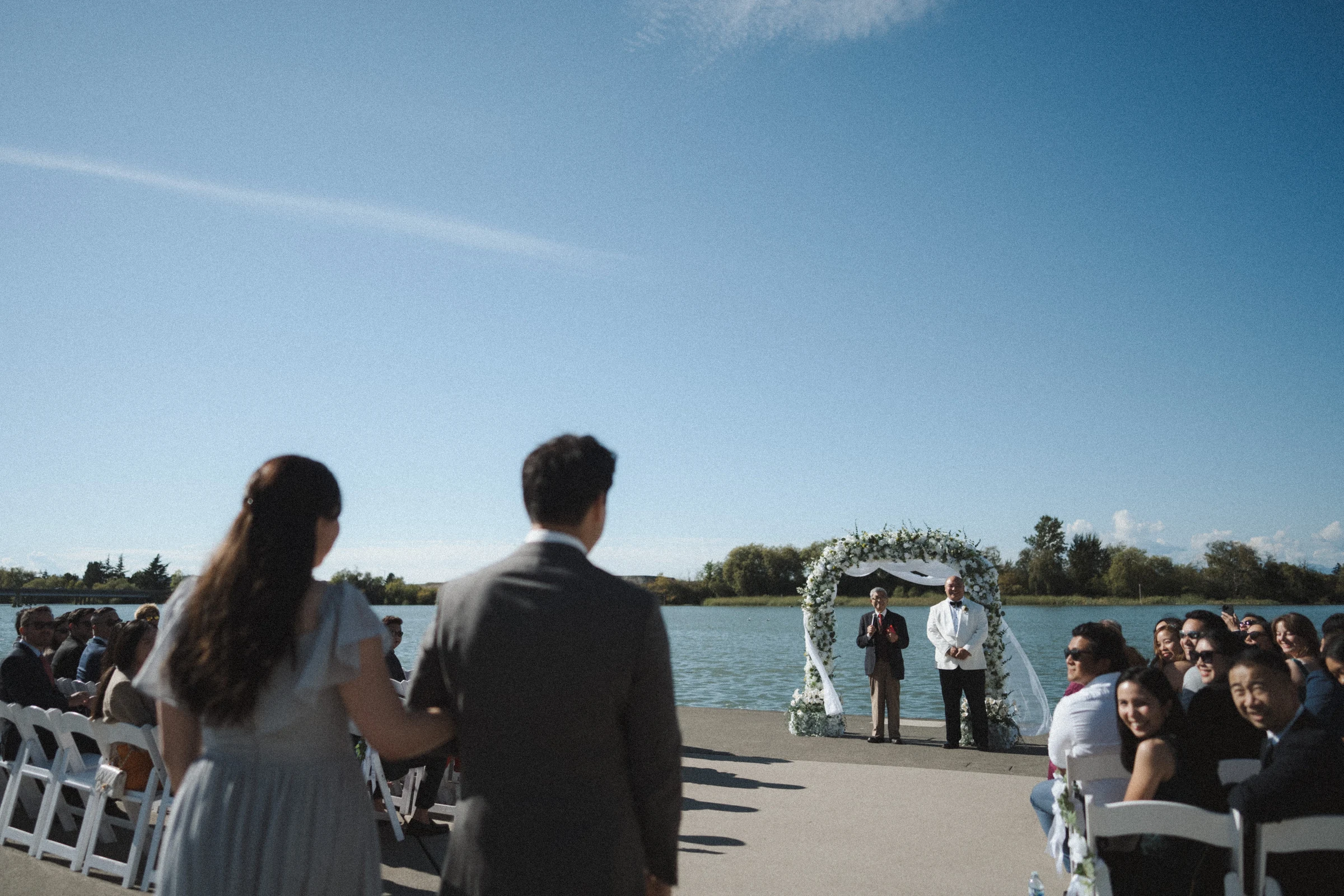 View towards the flower arch from behind standing guests.