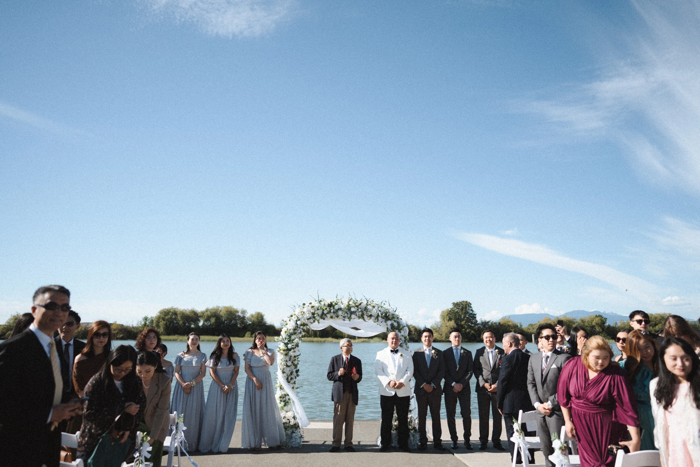 Guests standing on either side of the waterfront aisle.