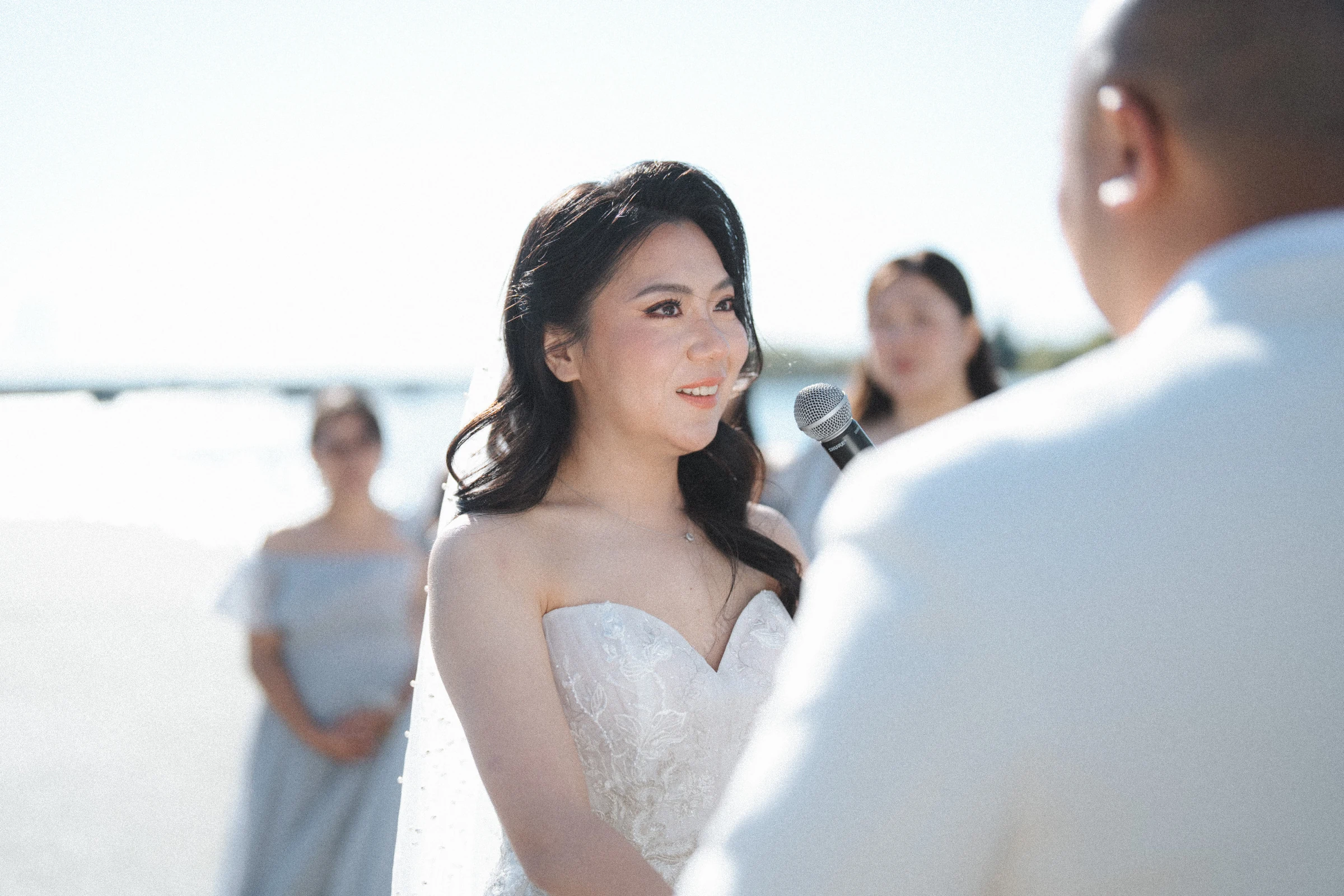 Bride looking towards the groom during the ceremony.