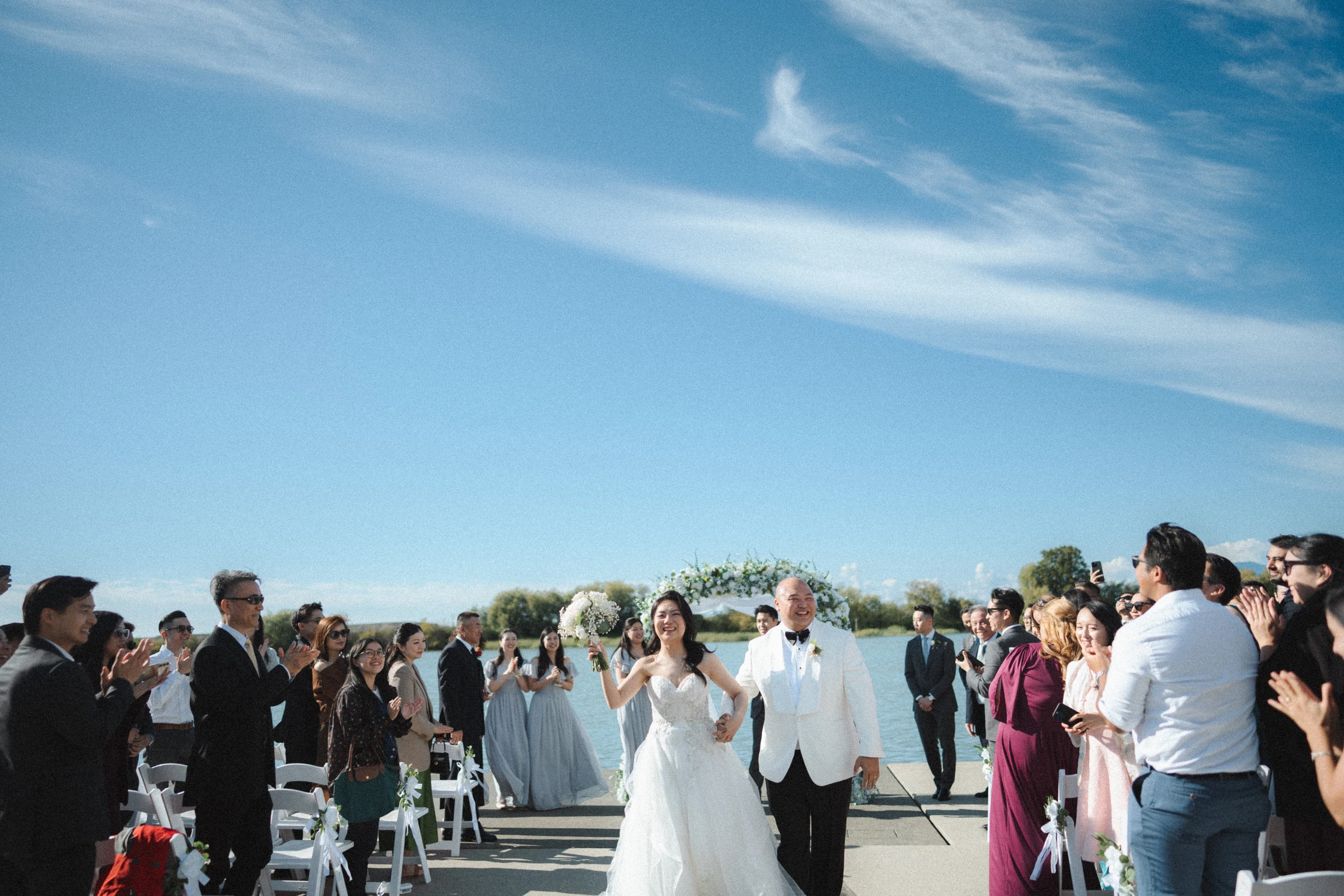 Couple beginning to walk back down the waterfront aisle.