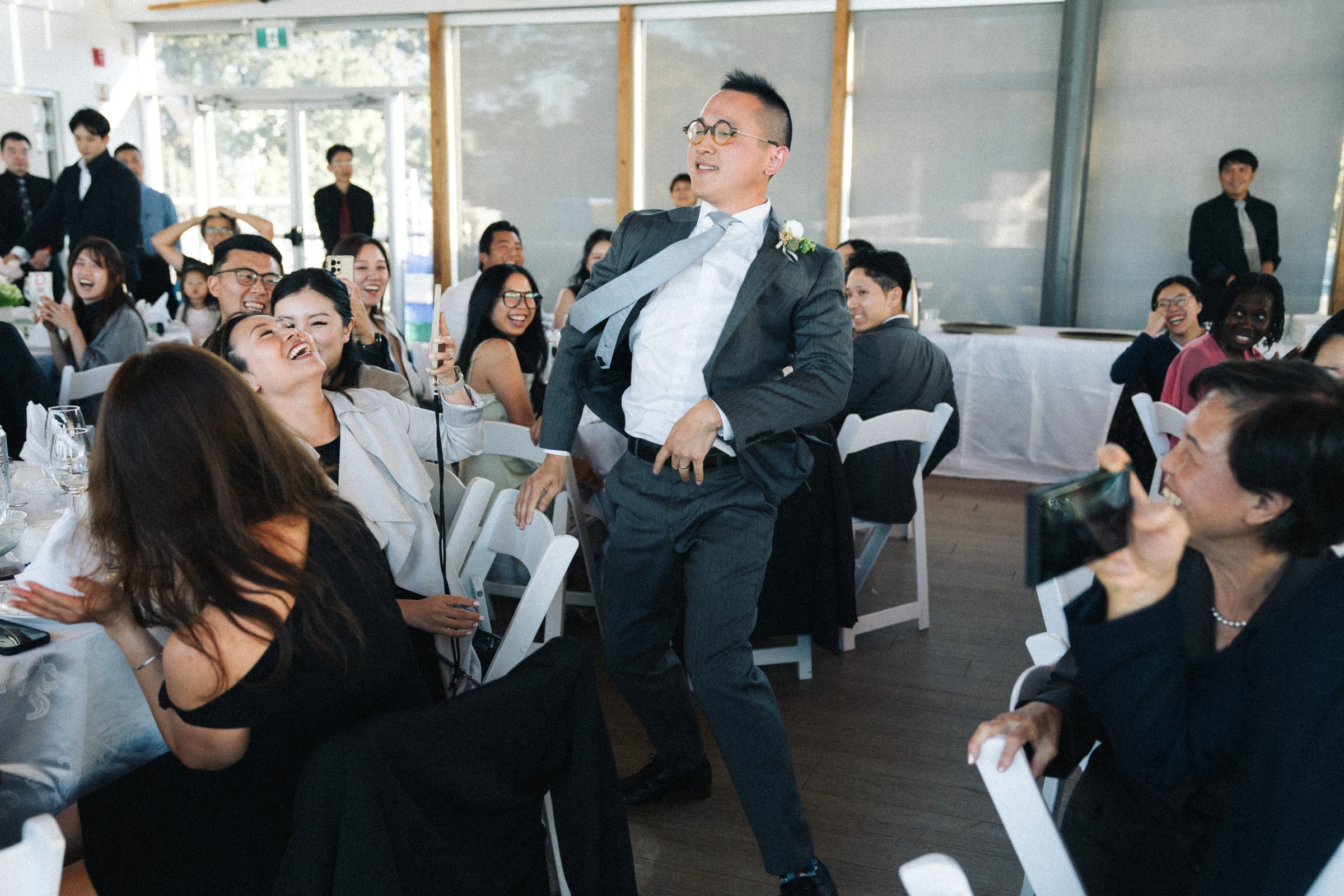 Guest making a dramatic entrance between the reception tables.