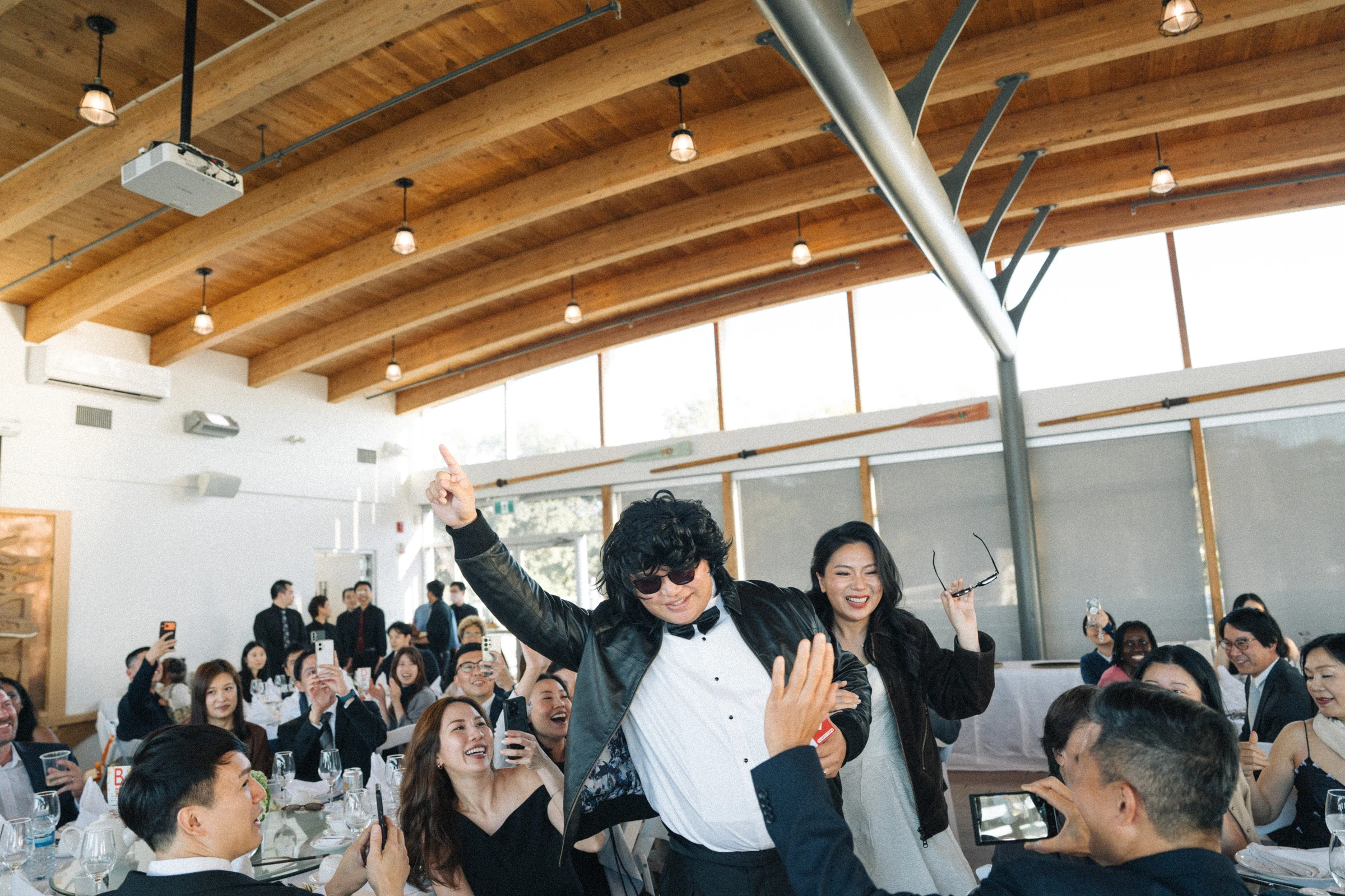 Guests dancing between the reception tables.