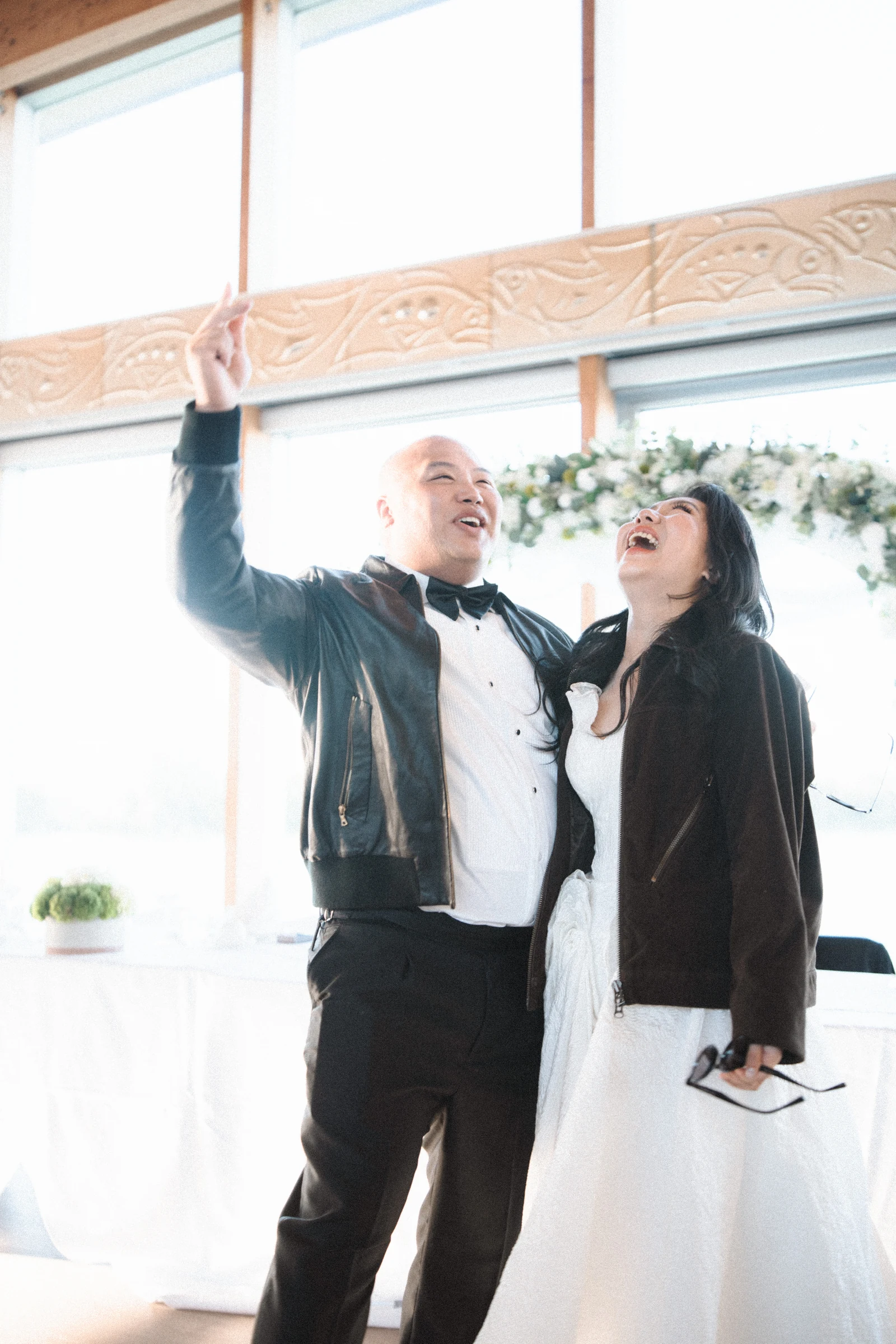 Guests raising their arms during the reception entrance.