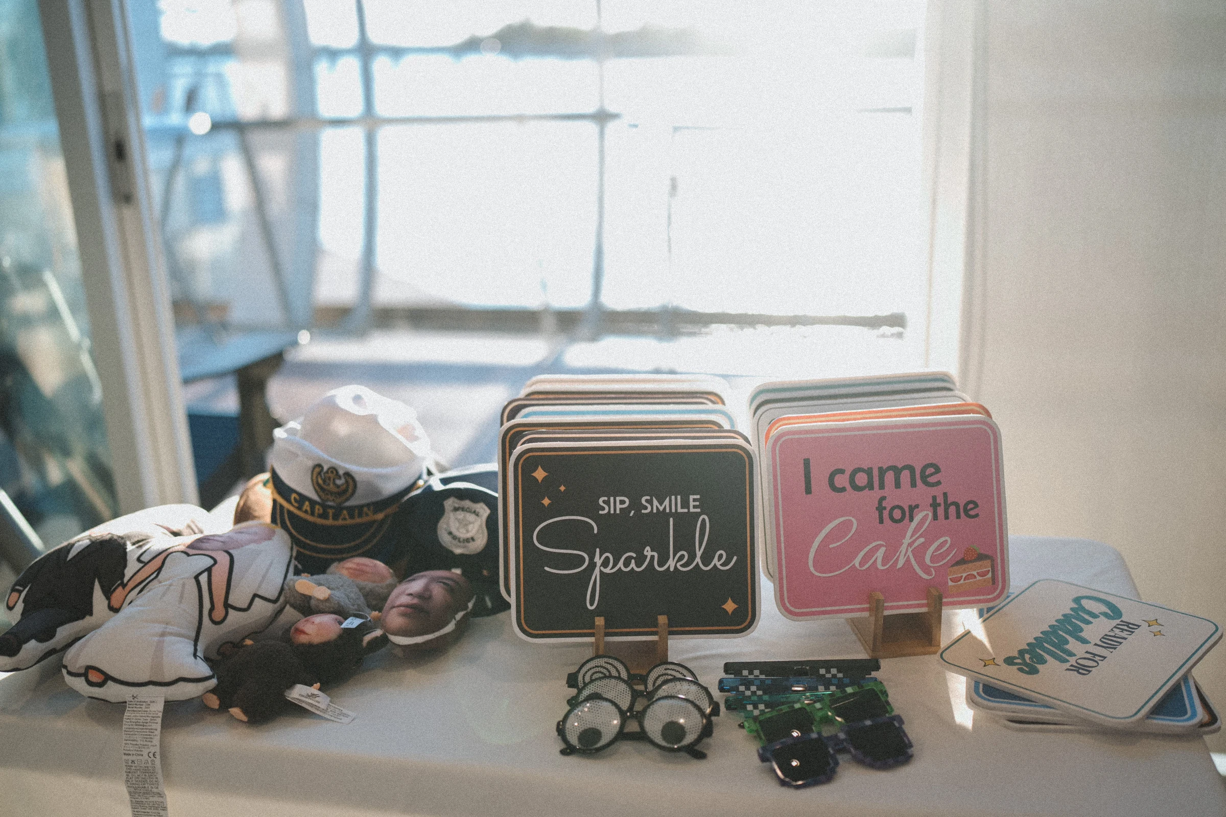 Personal keepsakes and small signs displayed beside the reception window.