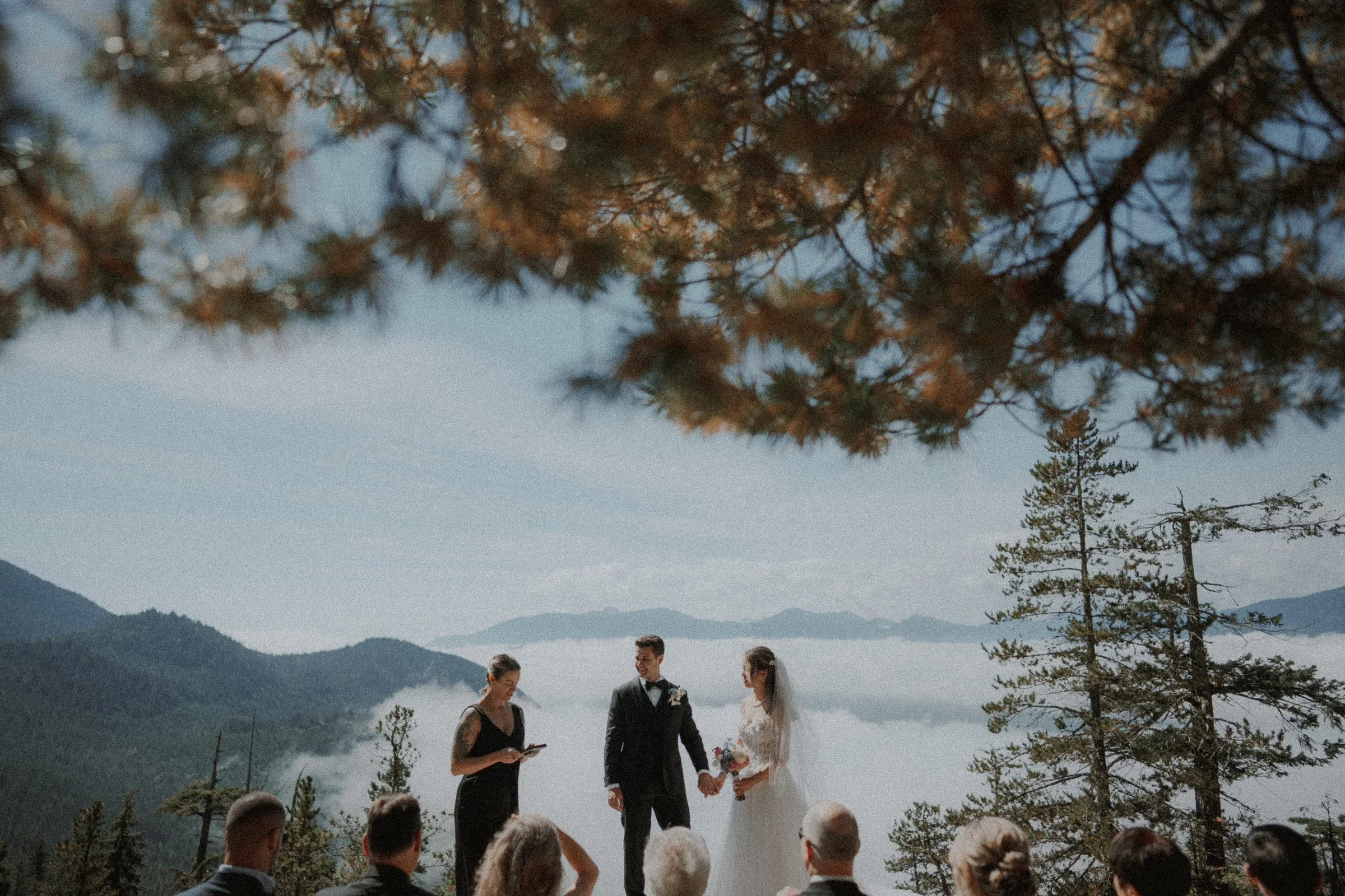 Couple facing one another during their Sea to Sky Gondola vows.