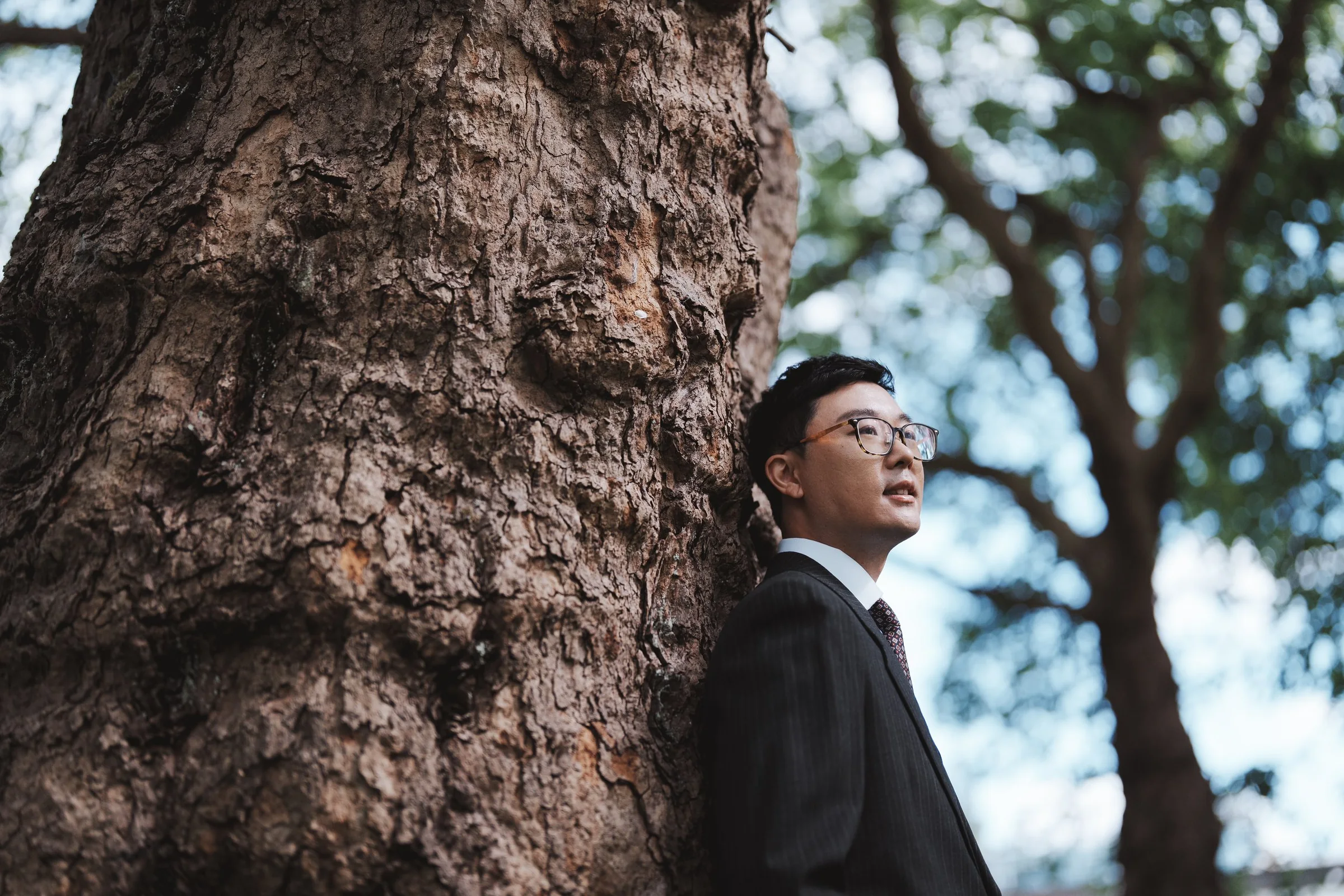 Marco beside a towering tree at Stanley Park, Vancouver